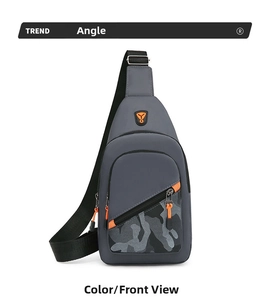Front view of grey nylon chest bag with camouflage detail and orange zipper accents