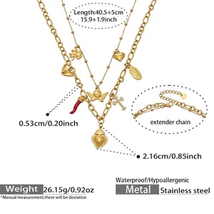 Detail view of 18k gold plated stainless steel layered necklace with diverse charms