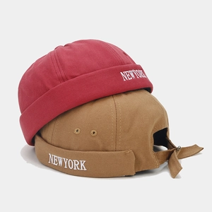 Retro Docker hats in burgundy and khaki featuring New York embroidery and adjustable strap