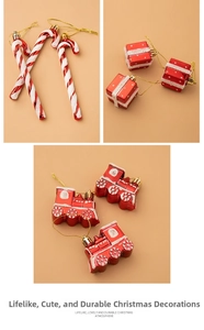Detailed close-up of red and white Christmas candy canes, gift boxes, and train ornaments