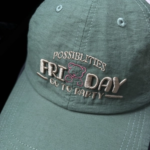 Forest green cotton baseball cap with letter embroidery and pink bear outline