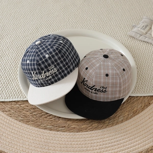 Kids plaid flat brim baseball caps with Kindness Club embroidery in navy and grey