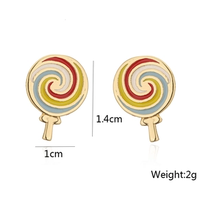 Detailed view of lollipop earrings in 18K gold-plated copper with colorful enamel swirls
