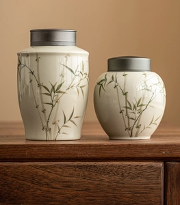 Detailed view of ceramic tea canisters with bamboo patterns and airtight alloy lids