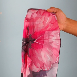 Detail of pink floral print mesh skirt with sheer texture and fine hem stitching