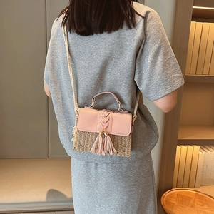 Pink leather and straw patchwork crossbody bag with decorative tassels for women