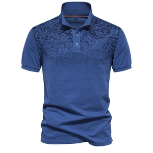 Detailed view of men's polo shirt with blue floral print and classic collar texture