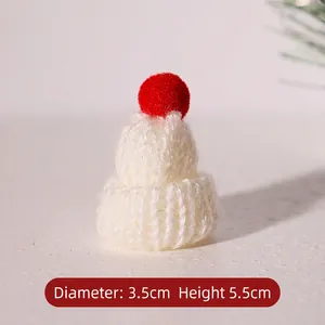 Detailed view of mini white knitted Christmas hat measuring 3.5cm wide and 5.5cm high