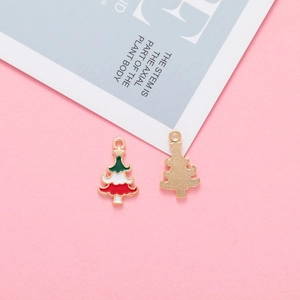 Detail of Christmas tree alloy charms in green and red for DIY jewelry making