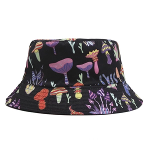 Reversible bucket hat with colorful psychedelic mushroom prints on a black background