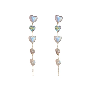 Elegant long tassel earrings with white pearls and heart-shaped crystals in silver needle