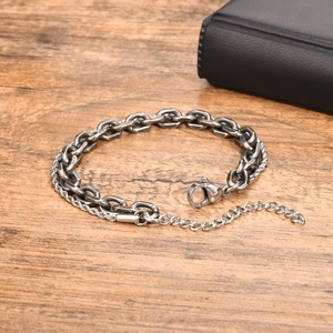 Detailed macro of stainless steel double-layer chain bracelet with lobster clasp