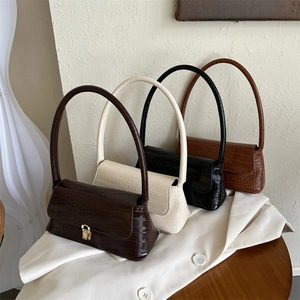Eleganti borse a mano con goffratura coccodrillo nei colori caffè, crema, nero e caramello