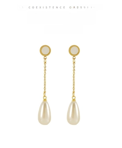 Detailed macro view of long 18K gold-plated stainless steel chain with drop pearl pendant