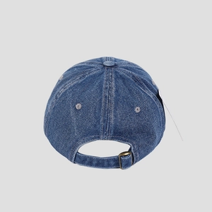 Detail view of denim baseball cap back with adjustable metal buckle and textured fabric