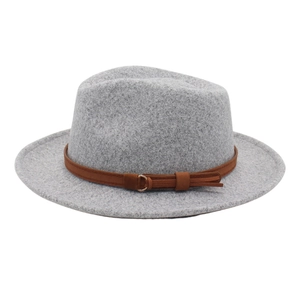 Detail showing grey wool fedora hat with a brown leather strap and gold buckle