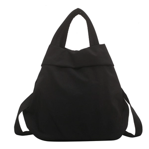 Minimalist black nylon tote bag with versatile multi-functional backpack strap design