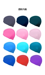 Detail of four-needle six-wire flatlock stitching on assorted color swim caps