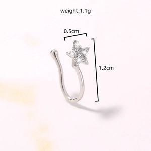 Macro shot of a silver star nose cuff with cubic zirconia stones showing 1.2cm height