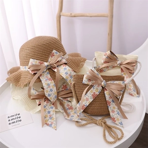 Girls' straw sun hat and crossbody bag set with floral ribbon bows for summer beach wear