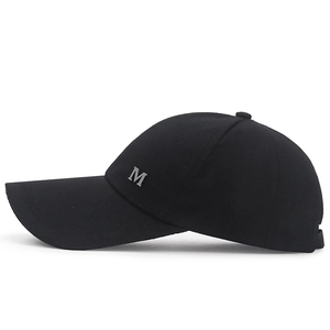 Classic black canvas baseball cap with long brim and silver metal M letter logo