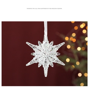 Macro shot of a transparent acrylic Christmas snowflake ornament with colorful glitter inside