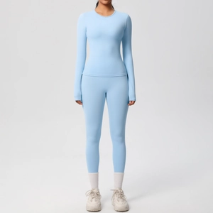 Set yoga celeste a maniche lunghe da donna con leggings per allenamento e fitness sportivo