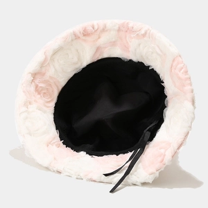 Chic warm bucket hat with pink rose pattern and cozy black lining for winter