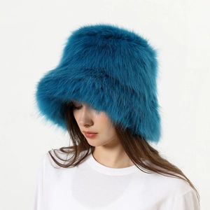 Detailed close-up of peacock blue faux fur texture on a thick winter bucket hat for women