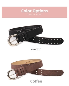 Close-up of black and coffee suede leather belts with silver rivets and metal buckles