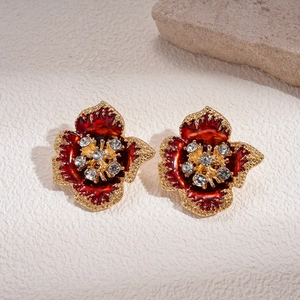 Retro red flower earrings with gold metal edges and sparkling crystal center