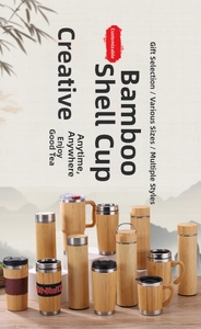 Various bamboo shell stainless steel mugs and tumblers displayed on wooden surface