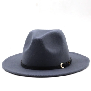 Detail shot of a grey wool fedora hat with a black leather band and gold metal buckle