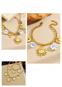 Detailed close-up of golden sun and heart charms with blue ceramic beads on a necklace set