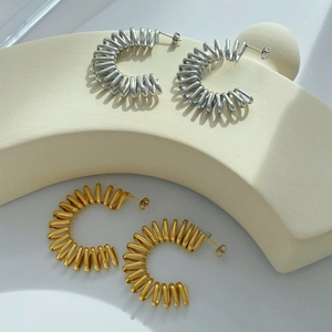 Minimalist C-shaped spiral spring earrings in gold and silver stainless steel finish