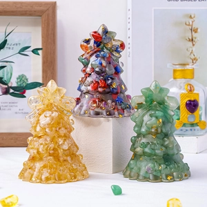 Three handmade resin Christmas trees with natural crystal stones and gold foil details