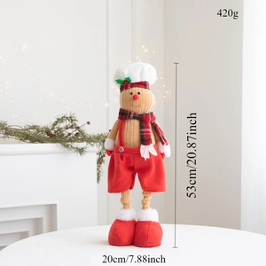 Détail de la poupée chef pain d'épices avec dimensions 53cm de haut sur table de fête