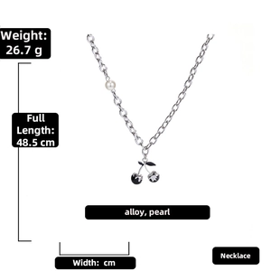Detail view of hip-hop cherry pendant necklace with white pearl on silver alloy chain
