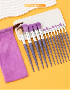 Detail of 13-piece purple makeup brush set with matching drawstring storage pouch