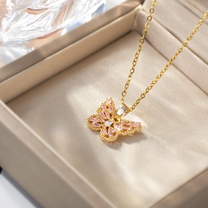 Exquisite gold butterfly pendant necklace with pink and white zircon stones in a jewelry box