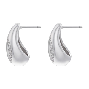 Macro detail of silver-tone teardrop earrings with pavé-set crystals on smooth edges