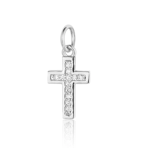Detail macro view of a silver cross pendant with sparkling zircon stone pavé setting