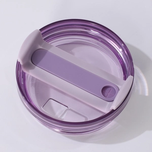 Detailed close-up view of a durable purple replacement lid for insulated tumbler cups