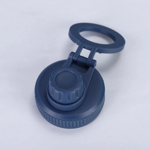Detail of blue stainless steel water bottle cap with integrated finger loop handle