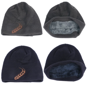 Detail showing the thick fleece lining and embroidery on the knitted beanie hat