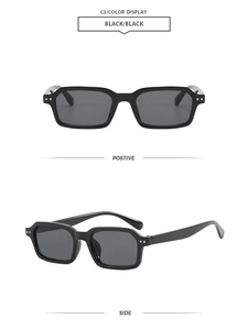 Detail view of vintage black rectangle sunglasses with silver dots on the frame
