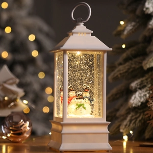 White Christmas snow globe lantern with three snowmen figures and warm LED lights