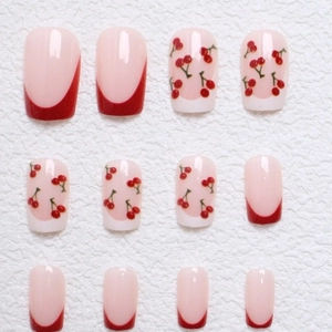 Sweet pink short square press-on nails with red French tips and cherry patterns
