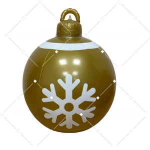 Detail of inflatable giant golden Christmas ball with white snowflake and top hanging loop