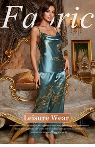 Detail of silk-like dark green floral pajama set with thin straps and wide leg pants